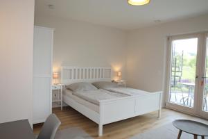 Ένα ή περισσότερα κρεβάτια σε δωμάτιο στο Appartements Rodenstein