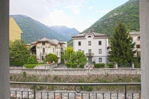 a view from a window of a town with mountains at Albergo Gusmeroli in Tirano