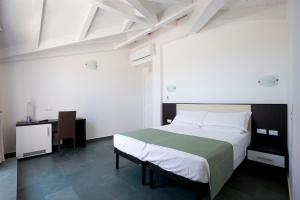 Postel nebo postele na pokoji v ubytování Dipendenza Hotel Bellavista