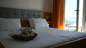 Postel nebo postele na pokoji v ubytování Hotel Ionian