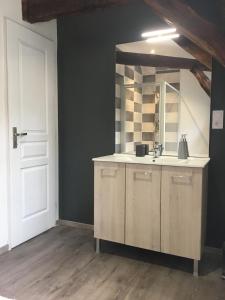 a kitchen with a sink and a white door at 4 Rue Jean Jaurès in Sarlat-la-Canéda