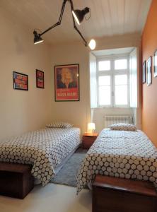 Säng eller sängar i ett rum på Ponto de Vista - Coimbra