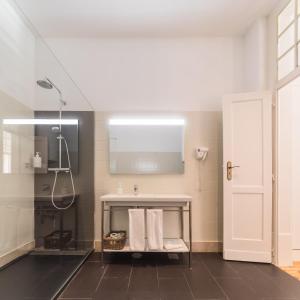 a bathroom with a sink and a shower at The Visionaire Apartments in Lisbon +44 photos