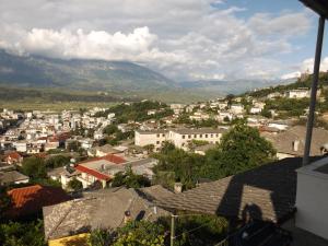 a view of a city with mountains in the background at Guesthouse Shtino in Gjirokastër