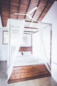 Postel nebo postele na pokoji v ubytování Rupa's Hotel