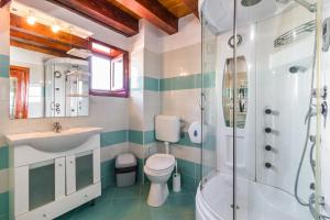 a bathroom with a sink toilet and a shower at Casa Luca in Vama Veche +166 photos