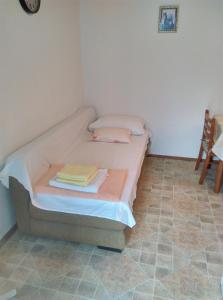 Postel nebo postele na pokoji v ubytování Nada Apartment