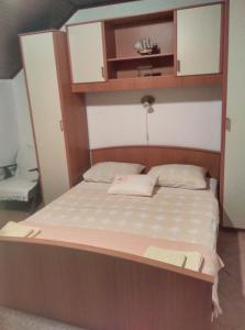 Postel nebo postele na pokoji v ubytování Nada Apartment