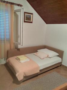 Postel nebo postele na pokoji v ubytování Nada Apartment