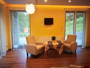 Televízia a/alebo spoločenská miestnosť v ubytovaní Apartament u Joli