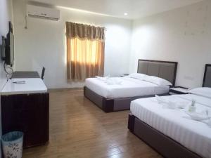 Postel nebo postele na pokoji v ubytování Meaco Royal Hotel - Tabaco + 10 fotografií