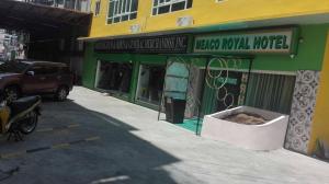 a store front of a new royal hotel on a street at Meaco Royal Hotel - Tabaco in Tabaco