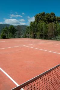 a tennis court with a net on top of it at Villa Turística de Laujar de Andarax in Laujar de Andarax