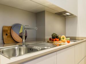 Kuchyňa alebo kuchynka v ubytovaní Milano Manzoni CLC Apartments