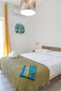 Posteľ alebo postele v izbe v ubytovaní Nonna Pina Art Rooms