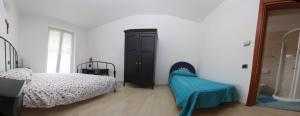 A bed or beds in a room at Apartment Lake Maggiore - ITALIA