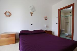 A bed or beds in a room at Apartment Lake Maggiore - ITALIA