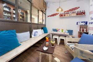 a living room with a couch and a table at Hotel Xaine Park in Lloret de Mar