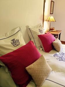two pillows sitting on top of a bed at Maison In Normandie in Saint-Pierre-la-Garenne