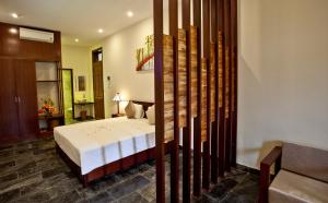 Voodi või voodid majutusasutuse Hoi An TNT Villa toas