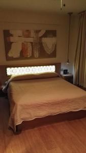 a bedroom with a large bed with a window at Mario's Garni in Pescocostanzo