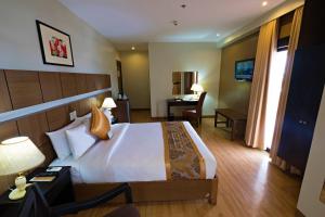 Krevet ili kreveti u jedinici u okviru objekta The Pinnacle Hotel and Suites