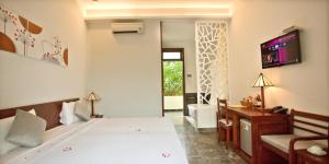 Voodi või voodid majutusasutuse Hoi An TNT Villa toas
