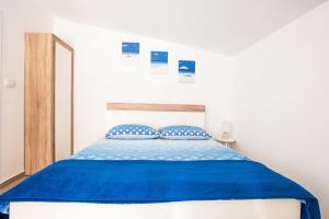 Posteľ alebo postele v izbe v ubytovaní Apartments Aria