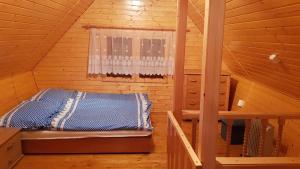 A bed or beds in a room at Chata Terchová - Vyšné Kamence