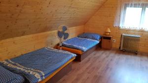 A bed or beds in a room at Chata Terchová - Vyšné Kamence