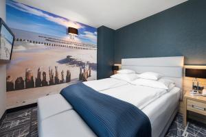 Posteľ alebo postele v izbe v ubytovaní Hotel Faleza - z widokiem na morze