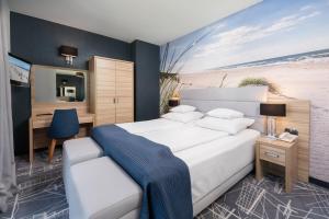 Posteľ alebo postele v izbe v ubytovaní Hotel Faleza - z widokiem na morze
