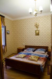 Кровать или кровати в номере Апарт - Отель Светлейший Князь Грузинский