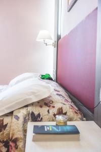 Posteľ alebo postele v izbe v ubytovaní Hotel Il Giardino