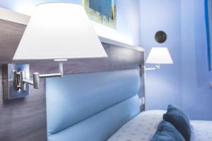 Posteľ alebo postele v izbe v ubytovaní Hotel Il Giardino