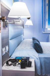 Posteľ alebo postele v izbe v ubytovaní Hotel Il Giardino