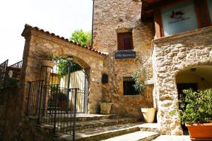 a stone building with stairs in front of it at Villa RosaMaria in San Chirico Raparo