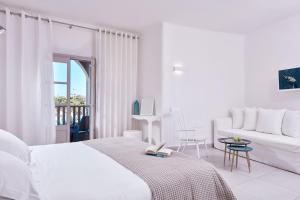 Postel nebo postele na pokoji v ubytování Santo Miramare Beach Resort