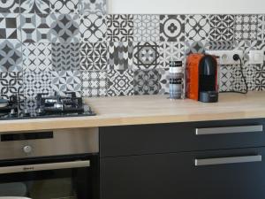 a kitchen with a counter with a coffee maker on it at Loire Escale in Ancenis