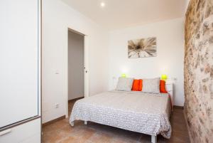 A bed or beds in a room at Sa Volta Nova