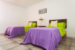A bed or beds in a room at Sa Volta Nova