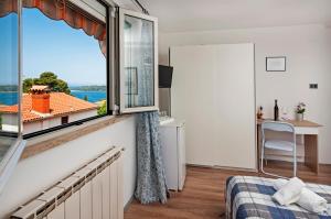 Postel nebo postele na pokoji v ubytování Rooms Mariana