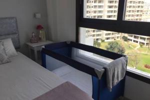 A bed or beds in a room at Apto a pie de playa con vistas increíbles!
