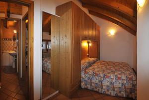 Postel nebo postele na pokoji v ubytování Residenza Al Castello