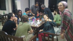 a group of people sitting around a table at Famous House Kathmandu in Kathmandu