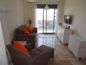 Televízia a/alebo spoločenská miestnosť v ubytovaní Apartment Marisol L'Ampolla