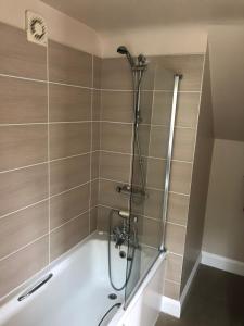 a shower with a glass door in a bathroom at The Cherry Tree in Woodbridge +30 photos