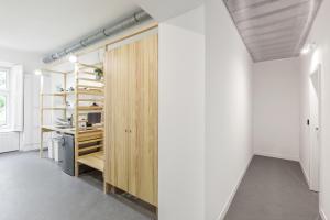 a room with a wooden floor and wooden cabinets at Flow Spaces in Budapest