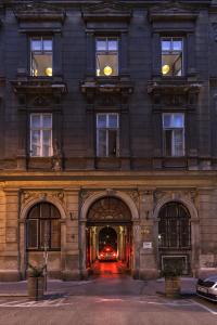 a building with a car parked in front of it at Flow Spaces in Budapest