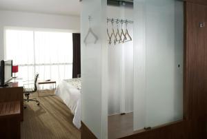 Postel nebo postele na pokoji v ubytování Casa Inn Premium Hotel Queretaro